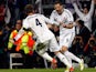 Real's Sergio Ramos is congratulated by team mates Karim Benzema after scoring his team's second against Dortmund on April 30, 2013