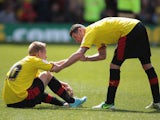 Watford's Matej Vydra gets helped up by Mark Yeats after they lost to Leeds United during the final day of the Championship Season on May 4, 2013