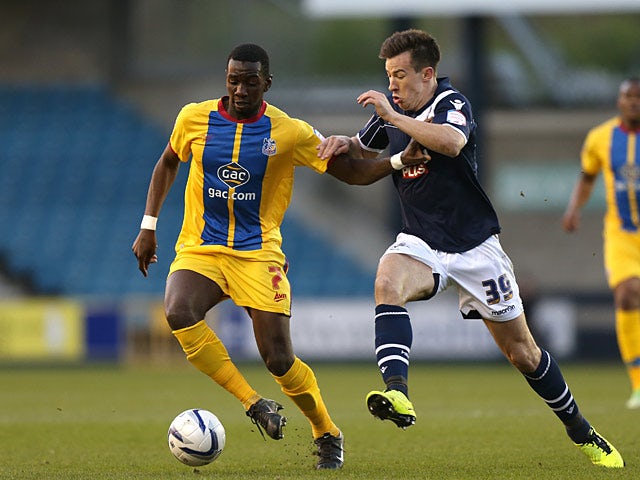 Crystal Palace's Yannick Bolasie and Millwall's Sean St Ledger battle for the ball on April 30, 2013