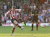 Brentford's Adam Forshaw scores the winning penalty against Swindon on May 6, 2013