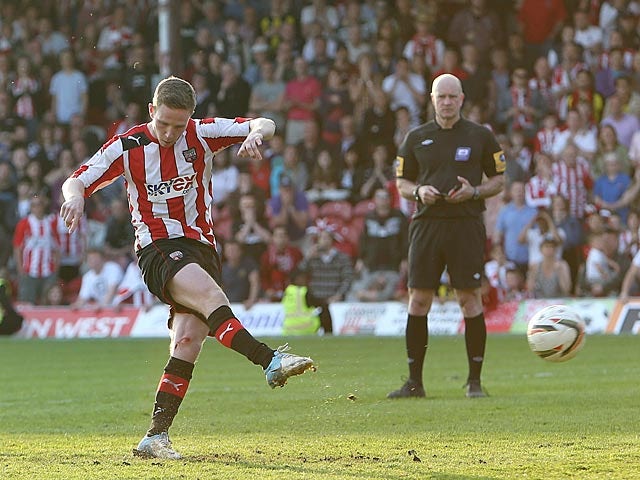 Brentford's Adam Forshaw scores the winning penalty against Swindon on May 6, 2013