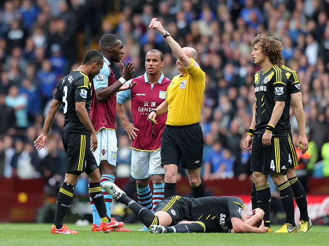 Aston Villa's Christian Benteke is shown a red card in the match against Chelsea on May 11, 2013
