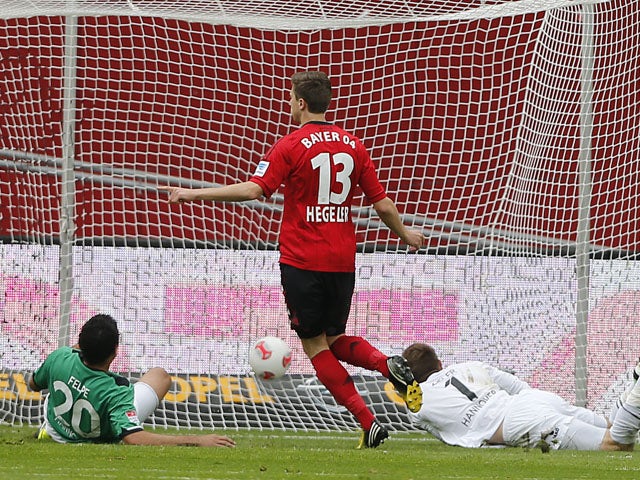 Leverkusen's Jens Hegeler scores during the Bundesliga clash with Hannover on May 11, 2013