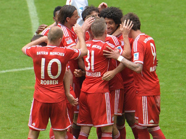 Bayern players celebrate scoring against Augsburg on May 11, 2013