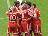 Bayern players celebrate scoring against Augsburg on May 11, 2013