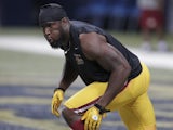 Skins' Brian Orakpo warms up before a game with the Rams on September 16, 2012