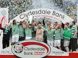 Celtic players celebrate with the SPL trophy on May 11, 2013