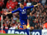 Cristiano Ronaldo celebrates scoring a free kick for Manchester United against Arsenal in 2009.