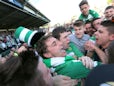 Tie winning goalscorer for Yeovil Town Ed Upson is mobbed by fans after the final whistle on May 6, 2013