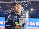 Britain's Alex Dowsett celebrates after winning the eight stage of the Giro d'Italia on May 11, 2013