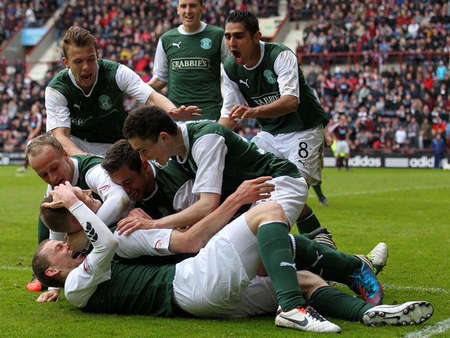 Hibernian's Ross Caldwell celebrates scoring in the SPL clash with Hearts on May 12, 2013