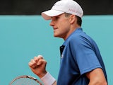 John Isner celebrates his win over Guillermo Garcia-Lopez in the Madrid Open on May 6, 2013