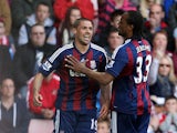 Jon Walters celebrates with team mate Cameron Jerome after scoring the opener against Sunderland on May 6, 2013