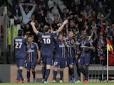 PSG players celebrate their side's goal in the Ligue 1 match against Lyon on May 12, 2013