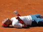 Rafael Nadal from Spain falls to the ground in celebration after winning the final of the Madrid Masters on May 12, 2013