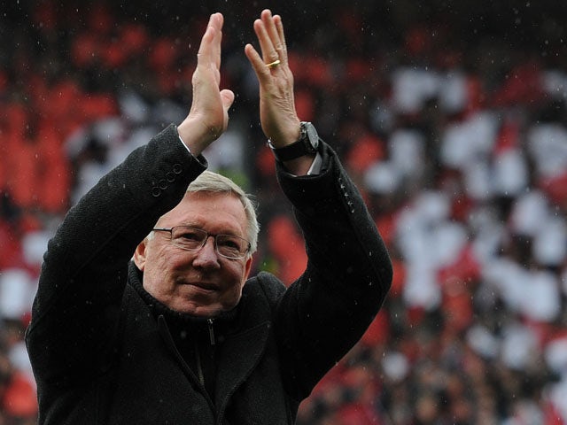 Manchester United manager Alex Ferguson applauds the crowd during his last home match in charge of the club on May 12, 2013