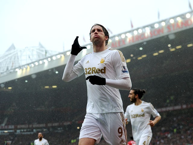 Swansea City's Miguel Michu celebrates scoring against Manchester United on May 12, 2013