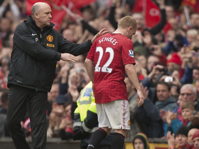 Paul Scholes leaves the Old Trafford pitch for the last time before retiring on May 12, 2013