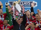 Manchester United manager Alex Ferguson lifts the Premier League trophy on May 12, 2013
