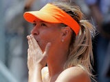 Maria Sharapova celebrates her win over Alexandra Dulgheru in the Madrid Open on May 6, 2013