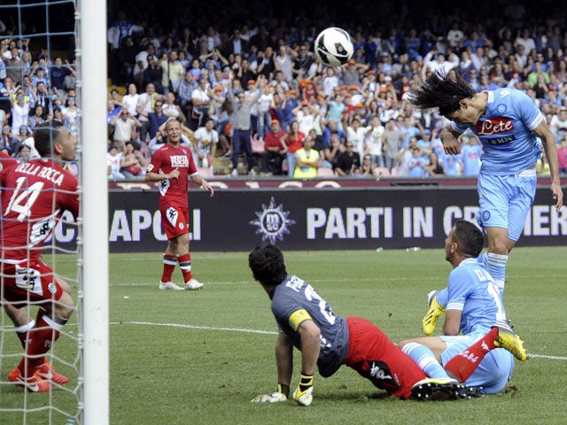 Napoli striker Edinson Cavani scores the winning goal in the match against Siena on May 12, 2013