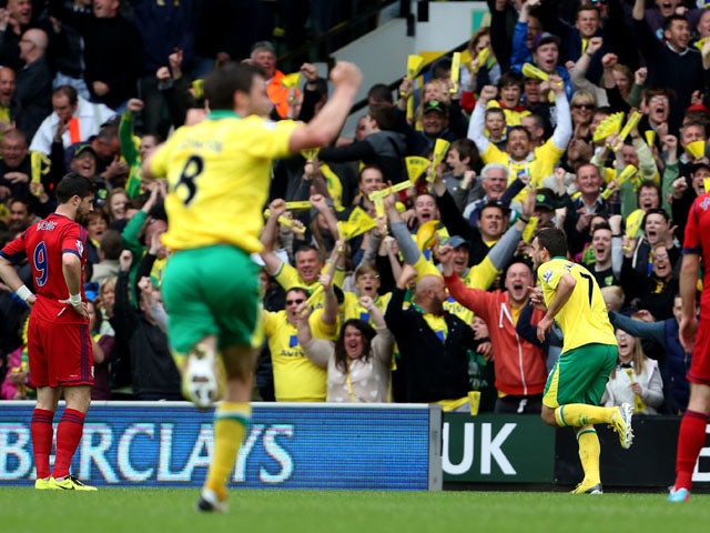 Norwich City's Robert Snodgrass celebrates after scoring against West Brom on May 12, 2013