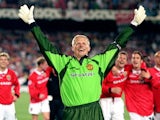 Goalkeeper Peter Schmeichel with his arms aloft after Manchester United win the Champions League in 1999.