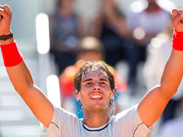 Rafael Nadal celebrates after beating Pablo Andujar in the Madrid Open semi finals on May 11, 2013