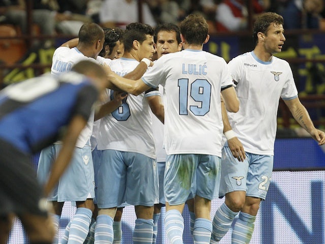 Lazio players congratulate Sergio Floccari following a goal against Inter on May 8, 2013