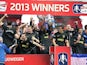 Wigan Athletic players celebrate on the pitch after beating Manchester City to win the FA Cup on May 11, 2013