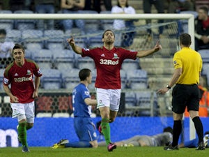 Swansea City's Itay Shechter celebrates scoring against Wigan Athletic on May 7, 2013 