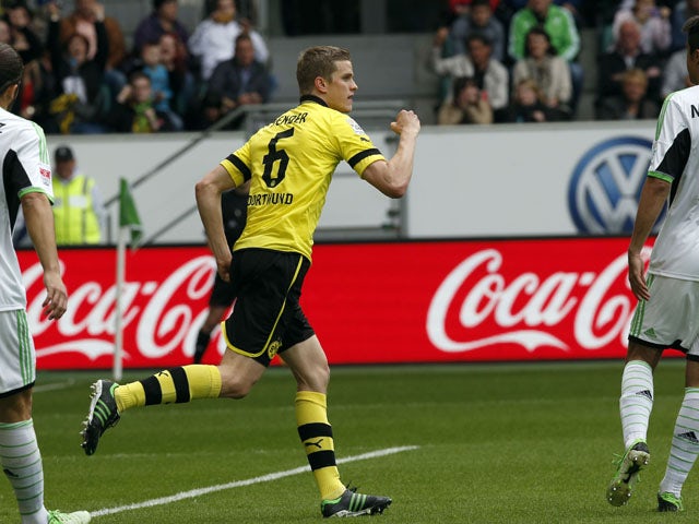 Dortmund's Sven Bender celebrates scoring against Wolfsburg during the Bundesliga match on May 11, 2013