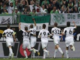 Wolfsburg players celebrate scoring against Borussia Dortmund in the Bundesliga match on May 11, 2103