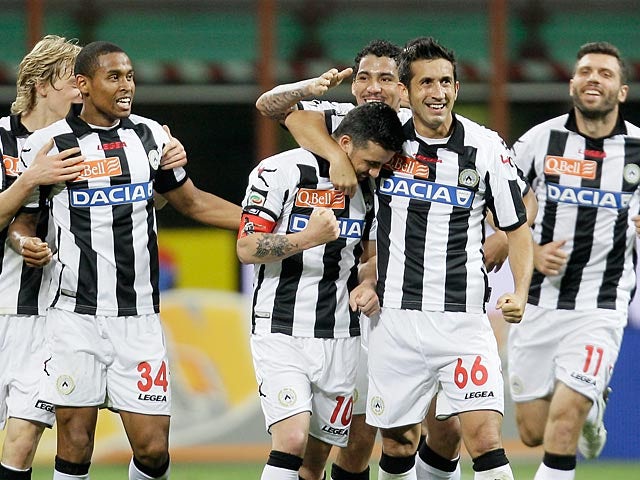 Udinese's Antonio Di Natale is congratulated by team mates after scoring his team's third against Inter on May 19, 2013