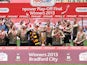 Bradford City players celebrates with the trophy after beating Northampton in the League Two play off final on May 18, 2013