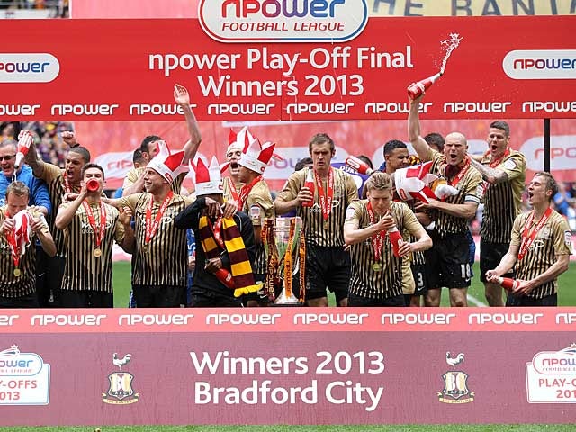 Bradford City players celebrates with the trophy after beating Northampton in the League Two play off final on May 18, 2013
