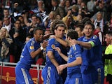 Chelsea's Branislav Ivanovic is mobbed by team mates after scoring the late winner against Benfica on May 15, 2013