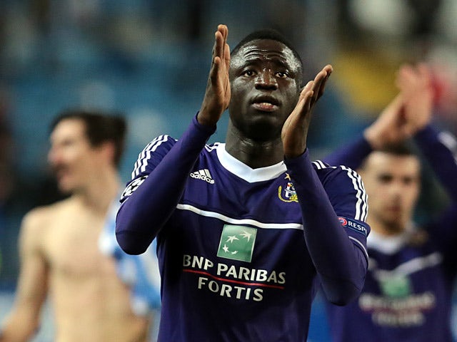 Anderlecht's Cheikhou Kouyate applauds fans at the final whistle on December 4, 2012