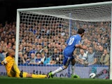 Chelsea's Juan Mata scores the first goal of the Premier League encounter with Everton on May 19, 2013