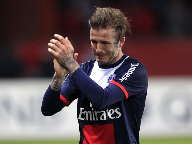 Paris Saint Germain's midfielder David Beckham cries as he leaves the field during his last ever match on May 18, 2013
