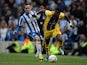 Brighton's David Lopez and Crystal Palace's Wilfried Zaha battle for the ball on May 13, 2013