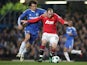 Chelsea's David Luiz and Manchester United's Wayne Rooney battle for the ball on March 1, 2011