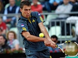 Jerzy Janowicz returns the ball to Richard Gasquet during their match at the Rome Masters on May 16, 2013