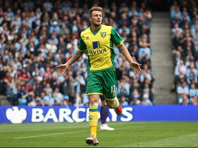 Norwich City's Anthony Pilkinton celebrates scoring against Manchester City on May 19, 2013