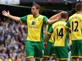 Norwich City's Grant Holt celebrates scoring against Manchester City on May 19, 2013