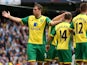 Norwich City's Grant Holt celebrates scoring against Manchester City on May 19, 2013