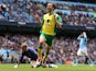 Norwich City's Jonathan Howson celebrates scoring his sides third goal against Manchester City on May 19, 2013