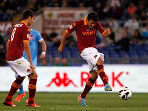 Roma's Marquinho scores the opening goal against Napoli on May 19, 2013