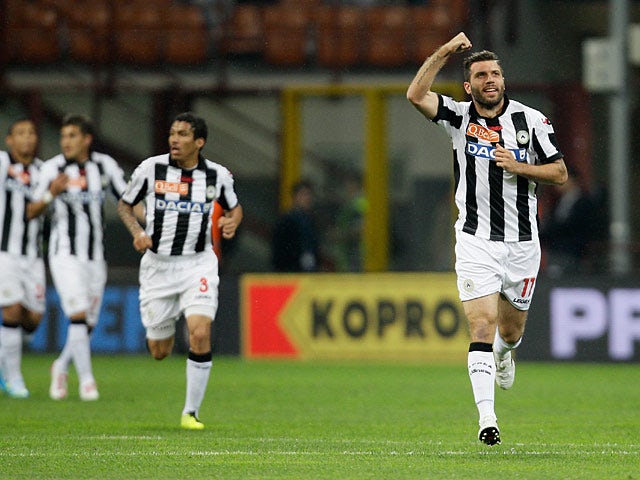 Udinese's Maurizio Domizzi celebrates after scoring his team's second goal against Inter on May 19, 2013