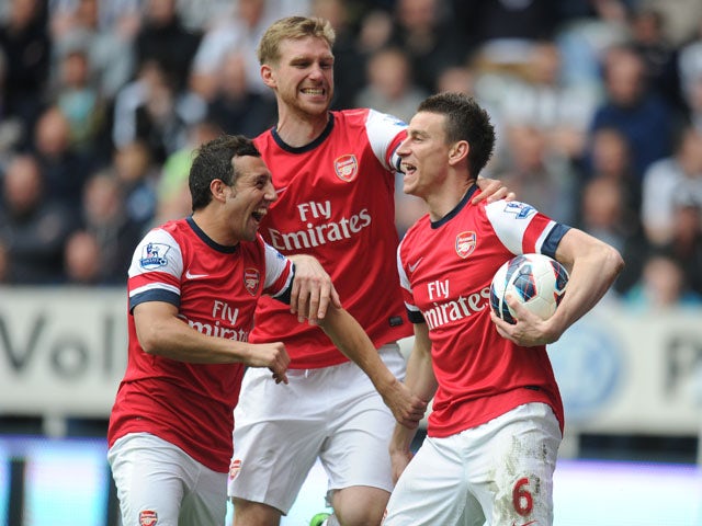 Arsenal Laurent Koscielny celebrates scoring against Newcastle on May 19, 2013